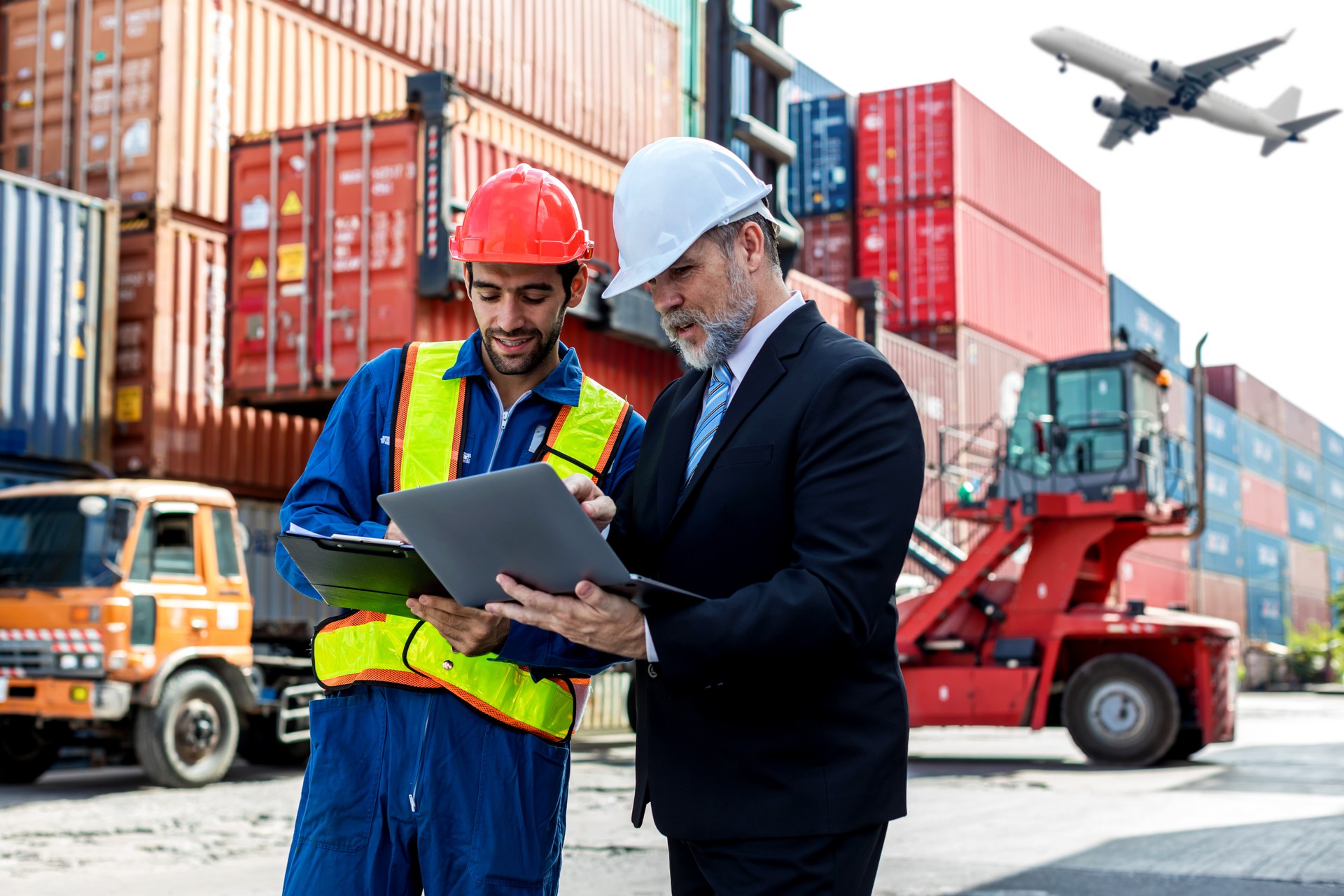 Foreman or worker work at Container cargo site check up goods in container. Foreman or worker checking on shipping containers. Logistics and shipping.